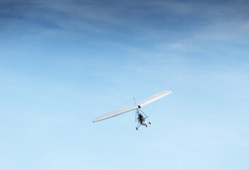 Fototapeta na wymiar People flying in the powered hang glider