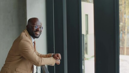 Portrait of confident businessman standing in conference venue