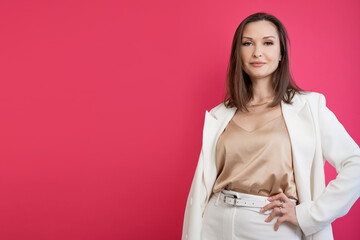 businesswoman stylish and elegant, modern business portrait on a bright background, Brunette in a white jacket - 608773502