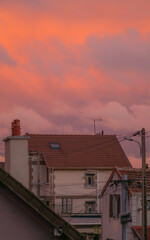 Sunset on a cloudy sky over the city