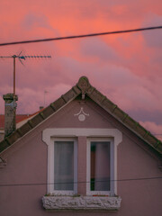 Sunset on a cloudy sky over the city