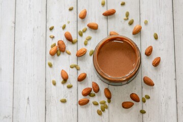 nut paste on a background of almond nuts