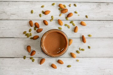 nut paste on a background of almond nuts
