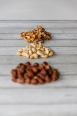 hazelnut, cashew and walnut lie on the table