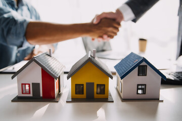 Business Signing a Contract Buy - sell house, insurance agent analyzing about home investment loan Real Estate concept.