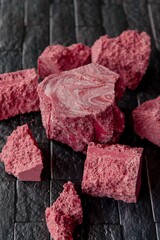wild raspberry chocolate slices on dark background