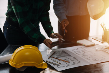 Engineer Teamwork Meeting, Drawing working on blueprint meeting for project working with partner on...