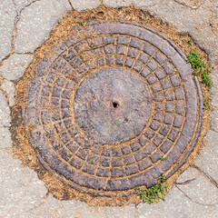 manhole cover on the pavement