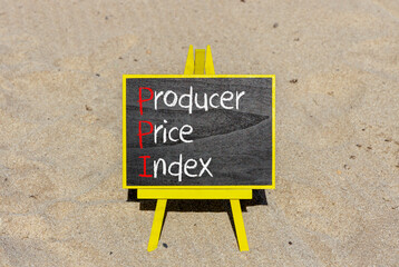 PPI Producer price index symbol. Concept words PPI Producer price index on beautiful black chalk blackboard. Beautiful sand beach background. Business and PPI Producer price index concept. Copy space