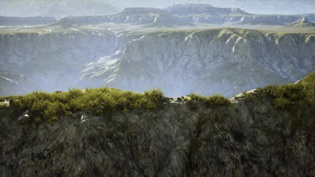 valley in Afghanistan, covered in dry grass and surrounded by mountains, with numerous rocks