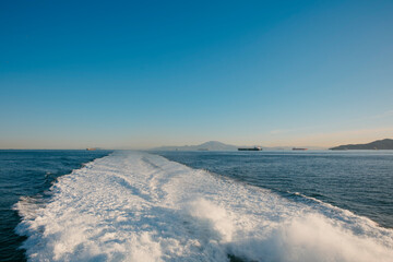 general view of the Strait of Gibraltar and the wake of a ship