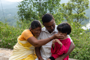 Joyful Indian Retired Couple Enjoying a Hill Station Vacation with Granddaughter