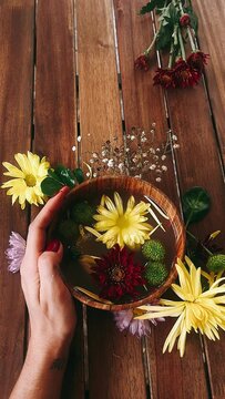 person with flowers, bowl of flowers, flower, flowers, nature, bouquet, beauty, plant, spring, summer, flora, yellow, blossom, floral, pink, spa, bloom, beautiful, autumn, daisy, purple, garden, petal