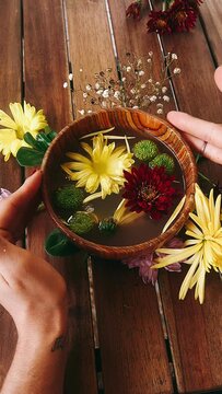 person with a bouquet of flowers, bowl of flowers, rituals, ritual, flower, food, green, plant, spa, leaf, yellow, vegetable, bowl, soup, white, tea, cactus, nature, natural, beauty, herb, flowers, li