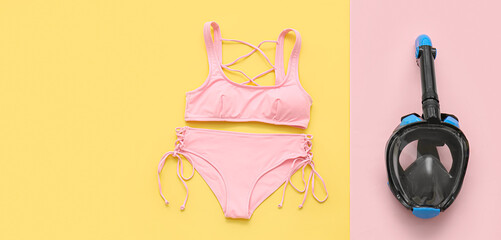 Female swimsuit with snorkeling mask on color background. Banner for design