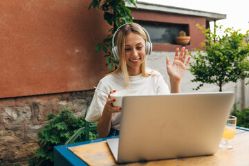 A young caucasian woman is talking in video call.