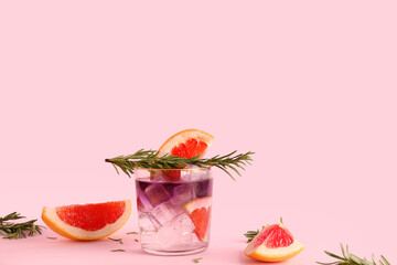 Classic gin and tonic with grapefruit on pink background
