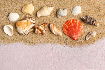 Sand with seashells on lilac background
