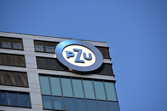 PZU insurance company logo, signage on the building facade. WARSAW, POLAND - MAY 21, 2023