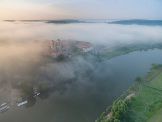 Aerial view of Tyniec abbey in the morning mists, beautiful sunrise, Krakow, Poland