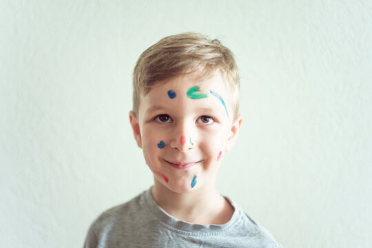 Boy Shows His face Painted With Paint
