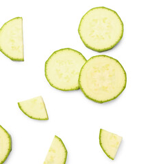 Slices of fresh zucchini on white background