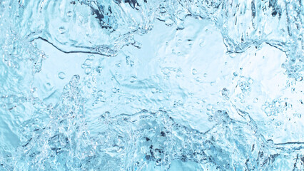Abstract water splashes isolated on blue background.