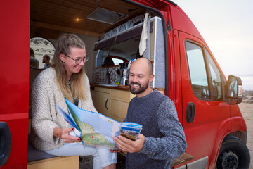 mid adult heterosexual couple traveling through South America in their camper trailer 