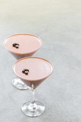 Vegan Coffee cream dessert, Coffee Panna Cotta in a martini glass. Light grey background. Copy space