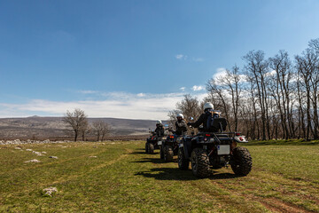 Quad ATV bikes in the middle of the beautiful landscape of the dinara torrent at the border between...