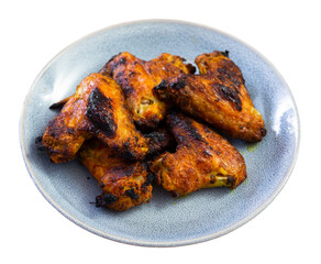 Appetizing baked chicken wings. Close-up image. Isolated over white background