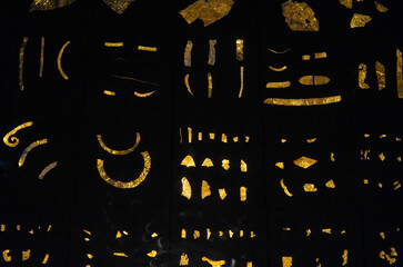 Old golden jewelry on black background