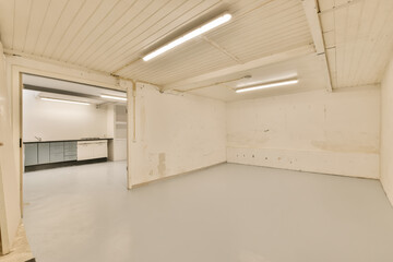 an empty room with white paint on the walls and ceiling beams in place where there is no furniture...