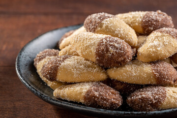 Shortbread biscuit covered with chocolate and crystallized sugar. In Brazil known as (Monteiro...