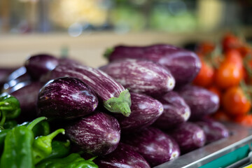 Fresh eggplants laid out nicely for sale in market