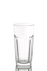 a long empty translucent glass beaker on a white background
