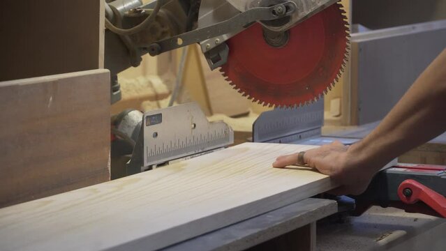 Slow Motion Close Up of Table Saw Cutting Wood on workshop