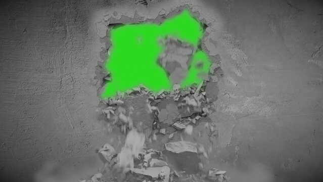 Hole blasting open in concrete wall green screen