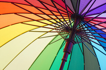 Rainbow umbrella for pride month, freedom and protection concept for LGBTQ+, selective focus