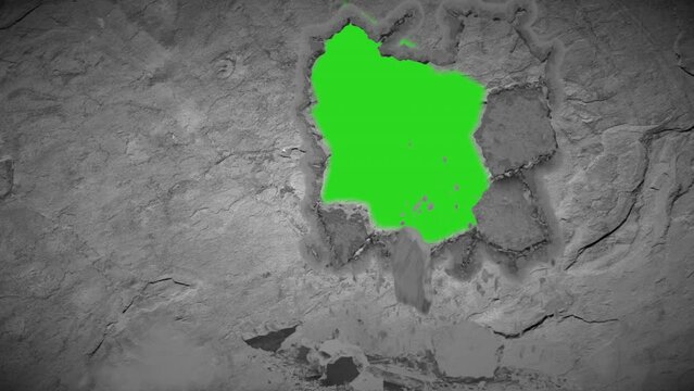 Hole blasted in slate wall green screen