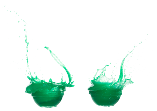 Green paint liquid fly in mid air, spill out glass bowl, apple vegetable juice falling scatter, explosion float in shape form droplet line. White background isolated freeze motion high speed shutter