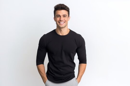 Portrait of handsome young man in black t-shirt smiling at camera