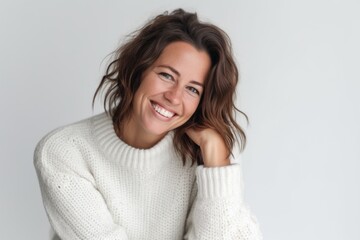 Portrait of a happy young woman smiling isolated on a white background