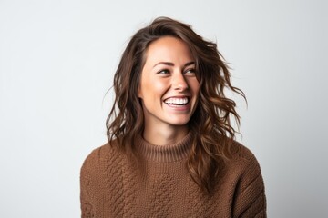 Close up portrait of a happy young woman smiling isolated on a white background