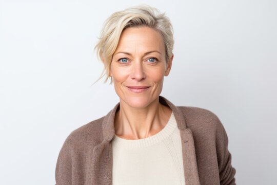 Portrait of a beautiful middle-aged woman with short blond hair.