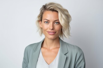 Portrait of a beautiful businesswoman smiling at the camera on a white background