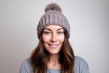 Portrait of a beautiful young woman wearing a knitted hat and sweater