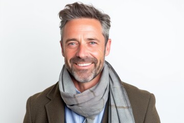 Obraz premium Portrait of a happy mature man with grey scarf on white background