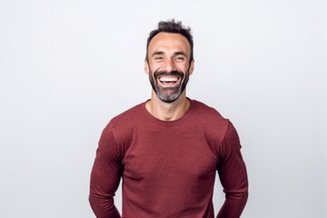 Obraz premium Portrait of handsome man smiling and looking at camera on white background