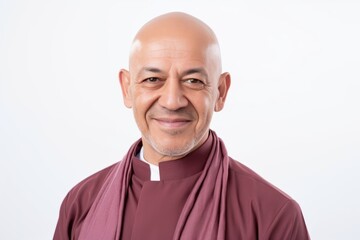 Obraz premium Portrait of a senior monk smiling at camera isolated on white background